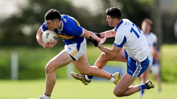12 April 2026; Sean O'Connor of Tipperary is tackled by Darach O'Cathasaigh of Waterford during the Munster GAA Football Senior Championship quarter-final match between Waterford and Tipperary at Cappoquin Logistics Fraher Field in Waterford. Photo by Mic