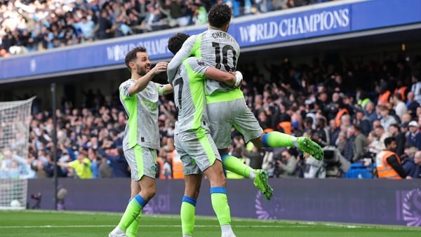 Rayan Cherki of Manchester City celebrates with Matheus Nunes and Bernardo Silva after Marc Guehi (not pictured) scores their second goal during the Premier League match between Chelsea and Manchester City at Stamford Bridge on April 12, 2026 in London, E