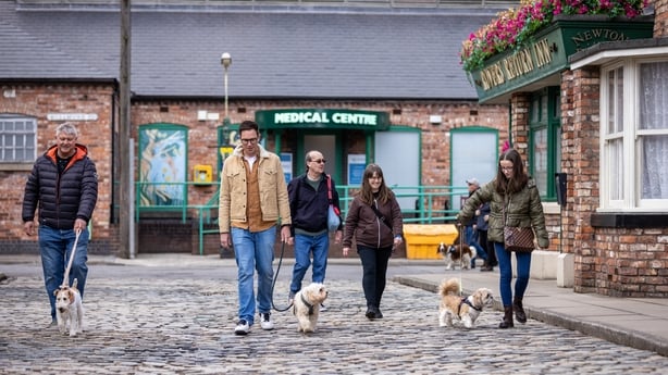 Dog walkers on the Coronation Street cobbles in Manchester. Photo: James Speakman/PA Media Assignments