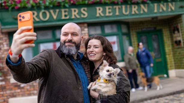 Jack and Francesca Sneath with their dog, Dollie, a Chihuahua, on the Coronation Street cobbles in Manchester. Photo: James Speakman/PA Media Assignments