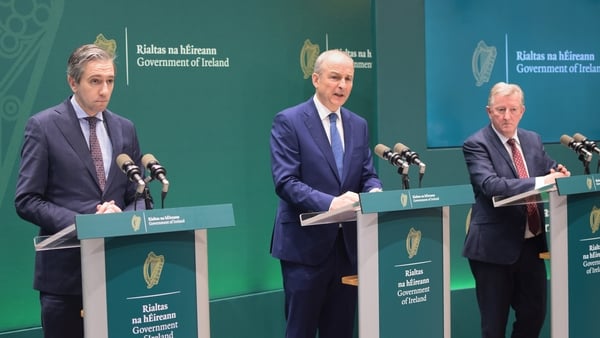 Tanaiste Simon Harris, Taoiseach Micheal Martin and Minister of State Sean Canney speaking at the Government Press Centre in Dublin