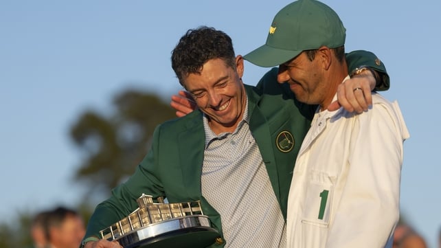 Rory McIlroy celebrates with his caddie Harry Diamond during the Green Jacket Presentation Ceremony