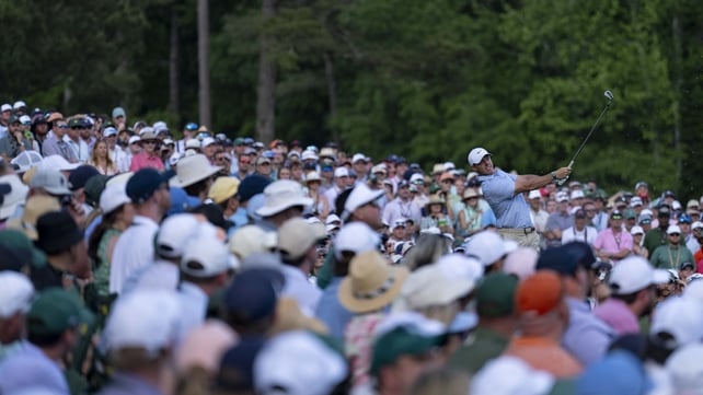 Rory McIlroy tees off as huge crowds watch on at the masters