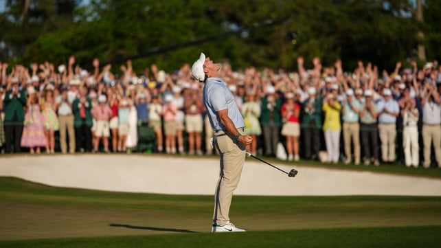 Rory McIlroy reacts to making the winning putt, on the 18th green, at the masters