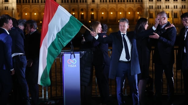 Peter Magyar waves a flag during the election evening in budapest