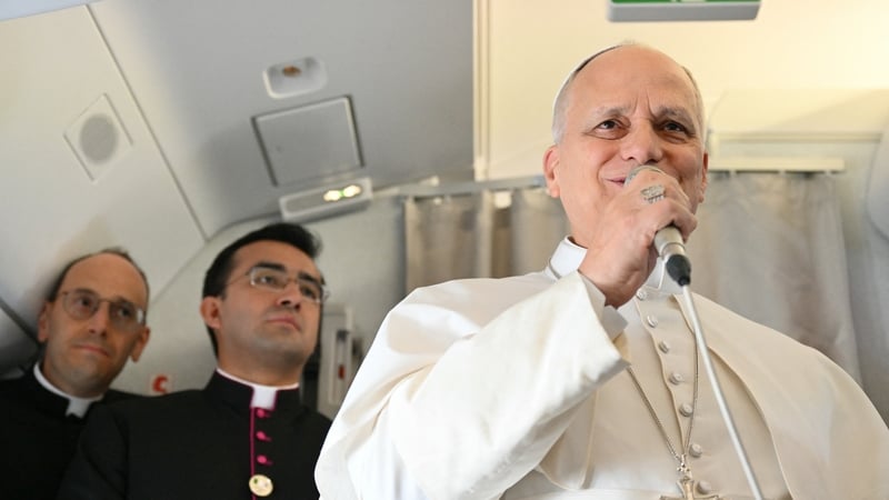 Pope Leo XIV addresses journalists during the flight heading to Algiers