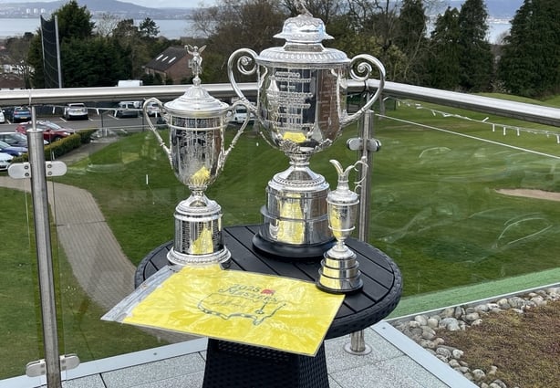 replica golf trophies on display