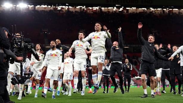 MANCHESTER, ENGLAND - APRIL 13: Players of Leeds United celebrate towards their fans after the team's victory in the Premier League match between Manchester United and Leeds United at Old Trafford on April 13, 2026 in Manchester, England. (Photo by Michael Regan/Getty Images)