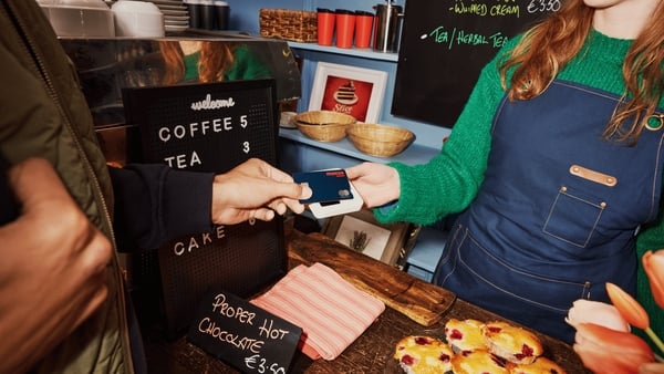 promo shot for monzo customer in cafe tapping card