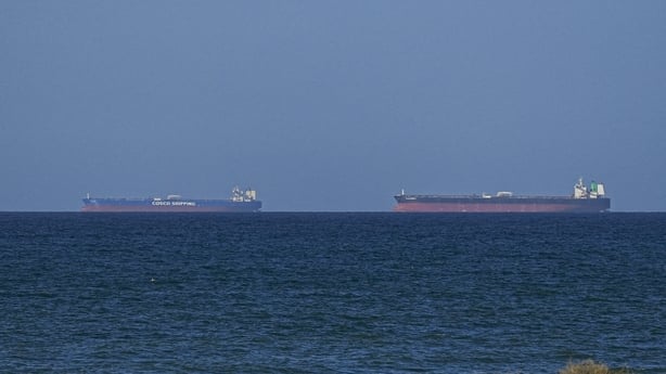 A ship waits to pass through the Strait of Hormuz 