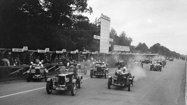 Start of a the Irish Grand Prix Saorstat Cup race, Phoenix Park, Dublin, 1930. Artist: Bill Brunell. Centre: Lea-Francis 1496S cc. Reg. No. KD7361. Entry No: 26. Driver: Higgin, D. Left: Lea-Francis 1496S cc. Vehicle Reg. No. UY5788. Entry No: 25. Driver: Field, J.F. Phoenix Park, Dublin. Irish Gran