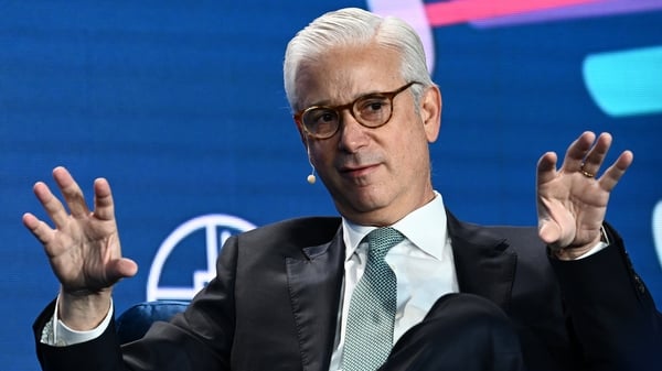 Image of a businessman speaking at a conference