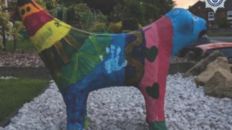 a sculpture of a lamb crossed with a banana and brightly coloured