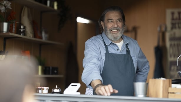 Ciarán Hinds smiles as Tom in The Dry
