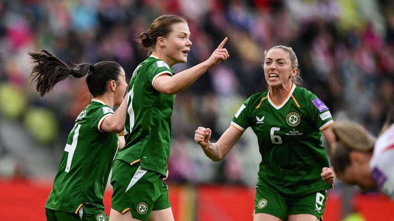 Emily Murphy of Republic of Ireland, centre, celebrates with teammates Marissa Sheva, left, and Megan Connolly after scoring goal against Poland, World Cup qualifier, April 2026