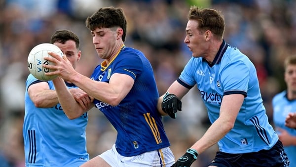 Jack Kirwan of Wicklow is tackled by Ross McGarry, left, and Peadar Ó Cofaigh Byrne of Dublin - 2025 Leinster Championship