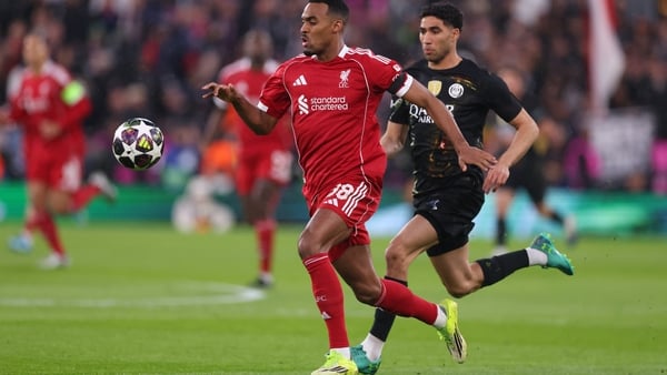 Alexander Isak of Liverpool runs with the ball under pressure from Achraf Hakimi of Paris Saint Germain during the UEFA Champions League 2025/26 Quarter-Final Second Leg match between Liverpool FC and Paris Saint-Germain FC at Anfield on April 14, 2026 i