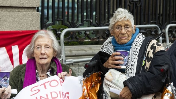 Photo shows Leilia Doolan on the left and Margarita D'Arcy sitting at a protest outside the Dáil in June 2025