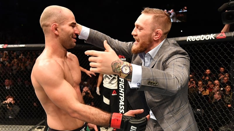Conor McGregor celebrates with friend and sparring partner Artem Lobov