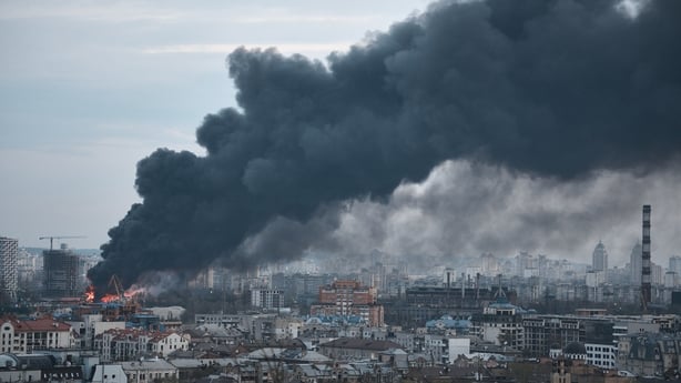A general view of the city of Kyiv shows a large fire at a secondary raw materials facility following an overnight Russian missile strike