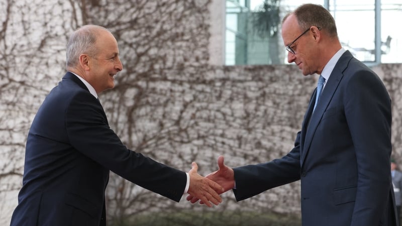 German Chancellor Friedrich Merz (R) welcomes Ireland's Prime Minister Micheal Martin at the Chancellery in Berlin on April 16, 2026. (Photo by Odd ANDERSEN / AFP)