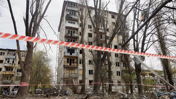 This photograph shows a damaged residential building following a Russian strike in Kyiv