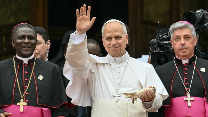 Pope Leo XIV (C) holds a white dove before releasing it after he met with the community of Bamenda at Saint Joseph's Cathedral in Bamenda, on the fourth day of an 11-day apostolic journey to Africa, on April 16, 2026. (Photo by Alberto PIZZOLI / AFP)
