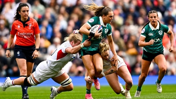 11 April 2026; Béibhinn Parsons Ireland is tackled by Abi Burton, left, and Megan Jones of England during the Women's Six Nations Rugby Championship match between England and Ireland at Allianz Stadium in Twickenham, England. Photo by Shauna Clinton/Sport