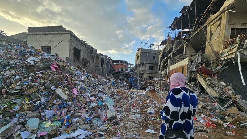 People inspect the aftermath of the previous day's Israeli airstrikes that targeted southern Beirut’