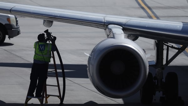 A worker fuels a United Airlines plane at Salt Lake City International Airport
