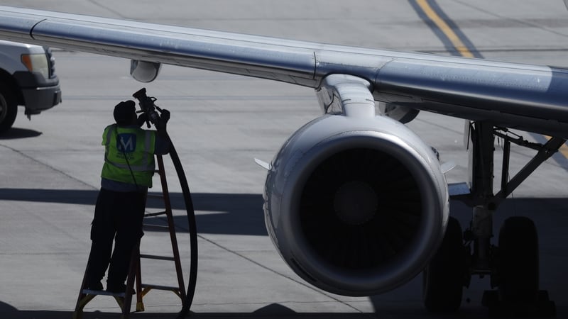 A worker fuels a United Airlines plane at Salt Lake City International Airport