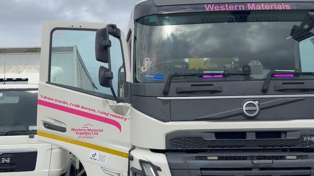 An image taken from the front of a truck as Sarah Wiers sits in the drivers seat