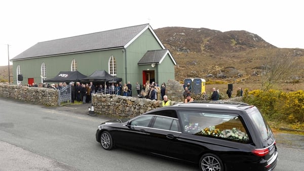 The hearse carrying the coffin of Clannad singer Moya Brennan arrives at the church