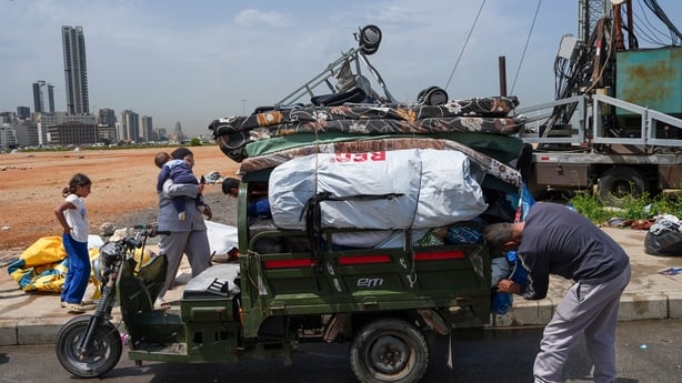 BEIRUT, LEBANON - APRIL 17: A displaced family packs their belongings at a displacement camp, before returning to their home in Southern Lebanon on April 17, 2026 in Beirut, Lebanon. At 00:00 on April 17, a 10-day ceasefire took effect that is meant to pause fighting between Israeli forces and the L