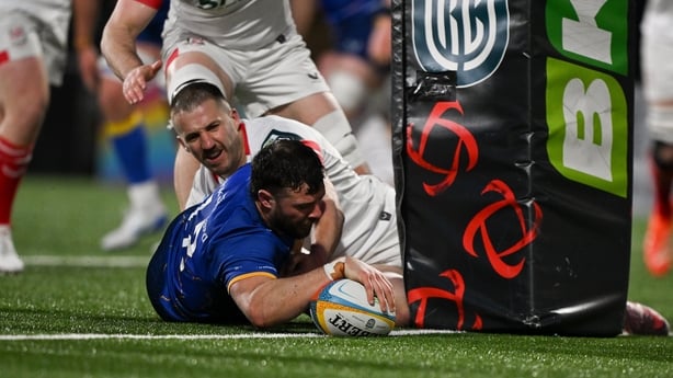 17 April 2026; Robbie Henshaw of Leinster scores his side's third try despite the tackle from Stuart McCloskey of Ulster during the United Rugby Championship match between Ulster and Leinster at Affidea Stadium in Belfast. Photo by David Fitzgerald/Sportsfile