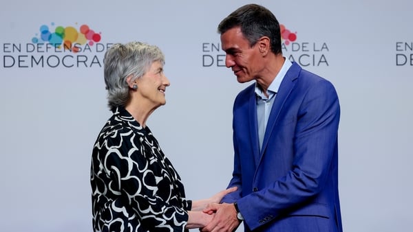 catherine connolly shakes hands with Spanish prime minister pedro sanchez