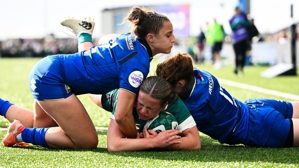 18 April 2026; Robyn O'Connor of Ireland scores her side's fourth try despite the efforts of Sara Mannini, left, and Gaia Buso of Italy during the Women's Six Nations Rugby Championship match between Ireland and Italy at Dexcom Stadium in Galway. Photo by Shauna Clinton/Sportsfile