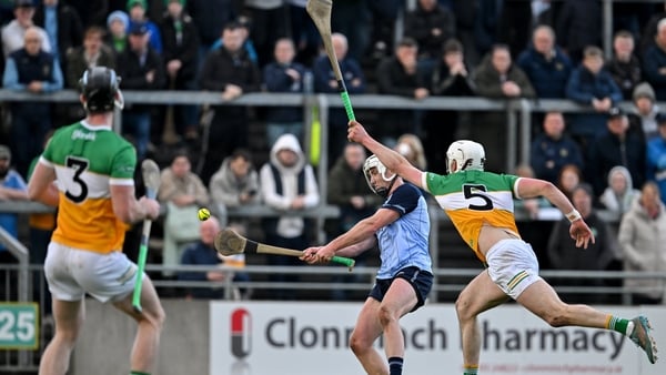 Darragh Power of Dublin scores a point despite the efforts of Ross Ravenhill, right, and Ben Conneely of Offaly - 2026 Leinster SHC