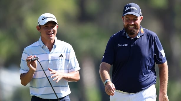 HILTON HEAD ISLAND, SOUTH CAROLINA - APRIL 17: Collin Morikawa of the United States and Shane Lowry of Ireland walk the third hole during the second round of the RBC Heritage 2026 at Harbour Town Golf Links on April 17, 2026 in Hilton Head Island, South Carolina. (Photo by Andrew Redington/Getty Ima