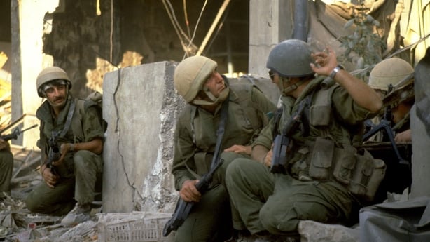 BEIRUT, LEBANON - AUGUST 10, 1982: (FILE PHOTO) In this archive image provided by the Israeli Government Press Office (GPO), Israeli army paratroopers advance against a suspected terrorist hide-out during Israel's Peace For Galilee military campaign August 10, 1982 in the southern quarters of the Le
