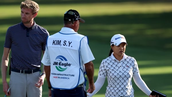 TARZANA, CALIFORNIA - APRIL 18: Sei Young Kim of South Korea reacts in front of a rules official and her caddie as she prepares to drop on the 16th green, where she would double bogey, during the third round of the JM Eagle LA Championship presented by Pl
