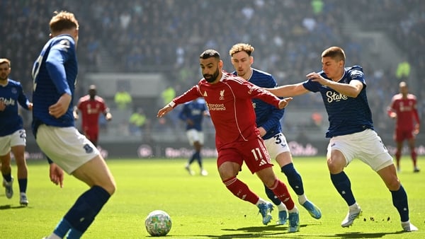 Liverpool's Egyptian striker #11 Mohamed Salah (C) vies with Everton's Ukrainian defender #16 Vitaliy Mykolenko (R) and Everton's English midfielder #37 James Garner (2R) during the English Premier League football match between Everton and Liverpool at Hi