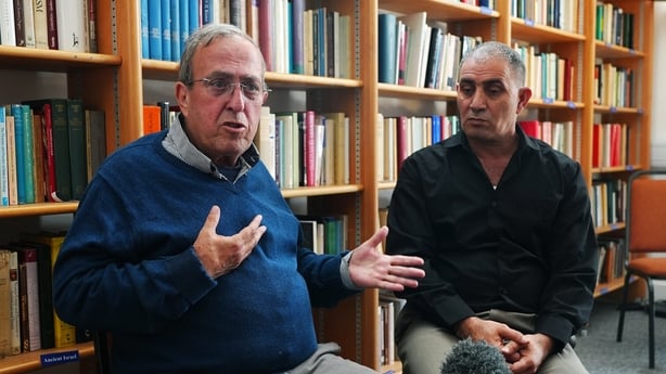 Men speak to cameras