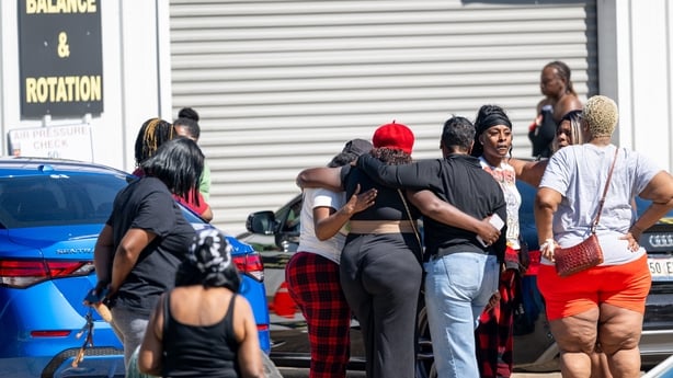 SHREVEPORT, LOUISIANA - APRIL 19: Community members gather to grieve the death of eight children and two women during a mass shooting on April 19, 2026 in Shreveport, Louisiana. Eight children were killed and two women were wounded during a domestic violence incident in the early morning hours, acco