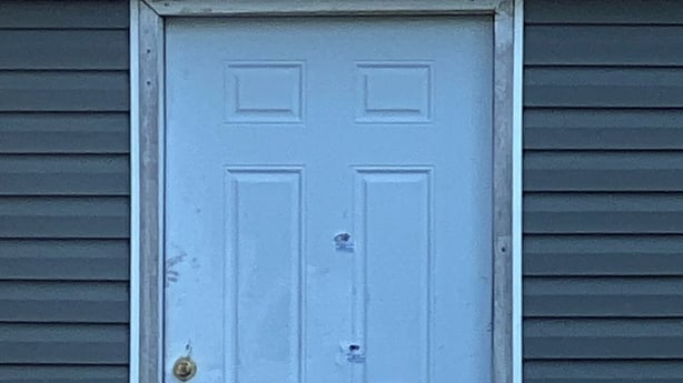 A woman is seen outside the house where a mass shooting took place in Shreveport, Louisiana, on April 19, 2026. Eight children were killed in a shooting spree early April 19 in the southern US state of Louisiana, in what police said appears to have been an incident of domestic violence. The incident