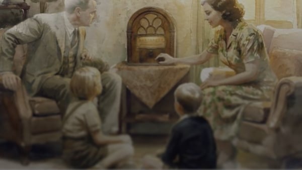 A family sit around the radio
