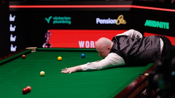 SHEFFIELD, ENGLAND - APRIL 19: John Higgins of Scotland plays a shot in the first round match against Ali Carter of England on day 2 of Halo World Championship 2026 at Crucible Theatre on April 19, 2026 in Sheffield, England. (Photo by Tai Chengzhe/VCG via Getty Images)