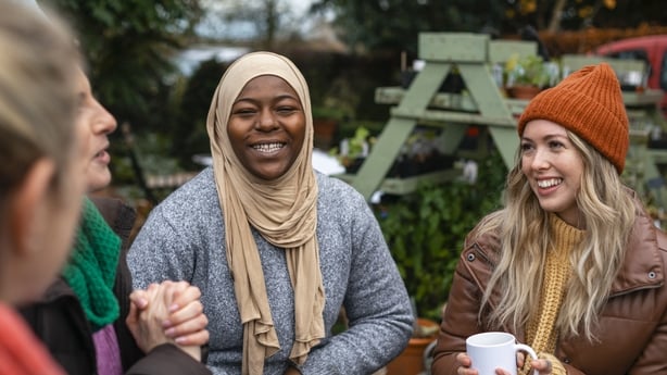 Volunteers sitting outdoors