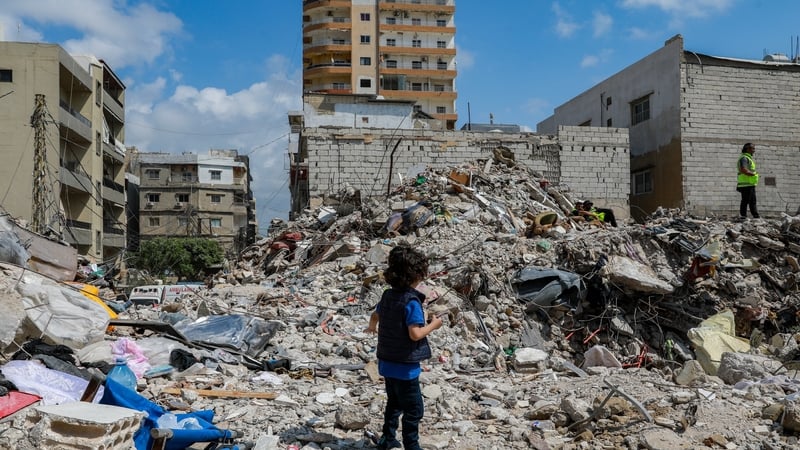 A view of the destruction after an Israeli airstrike that targeted six adjacent buildings just three minutes before the ceasefire took effect speaks in Tyre, Lebanon