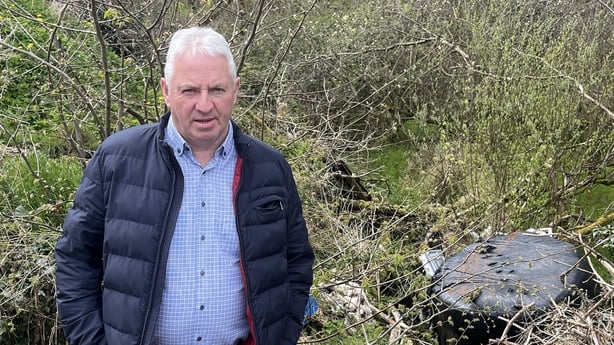 Councillor Kevin McElvogue at the illegal dumping site in Co Tyrone